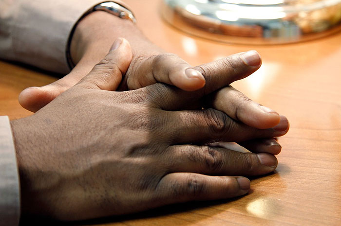 Image of man hands on table