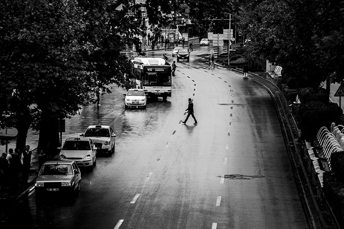 Image of man crossing street