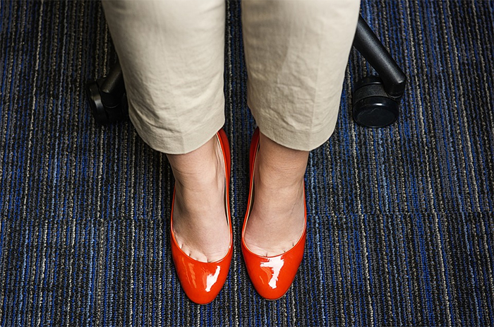 Woman's legs in red heels