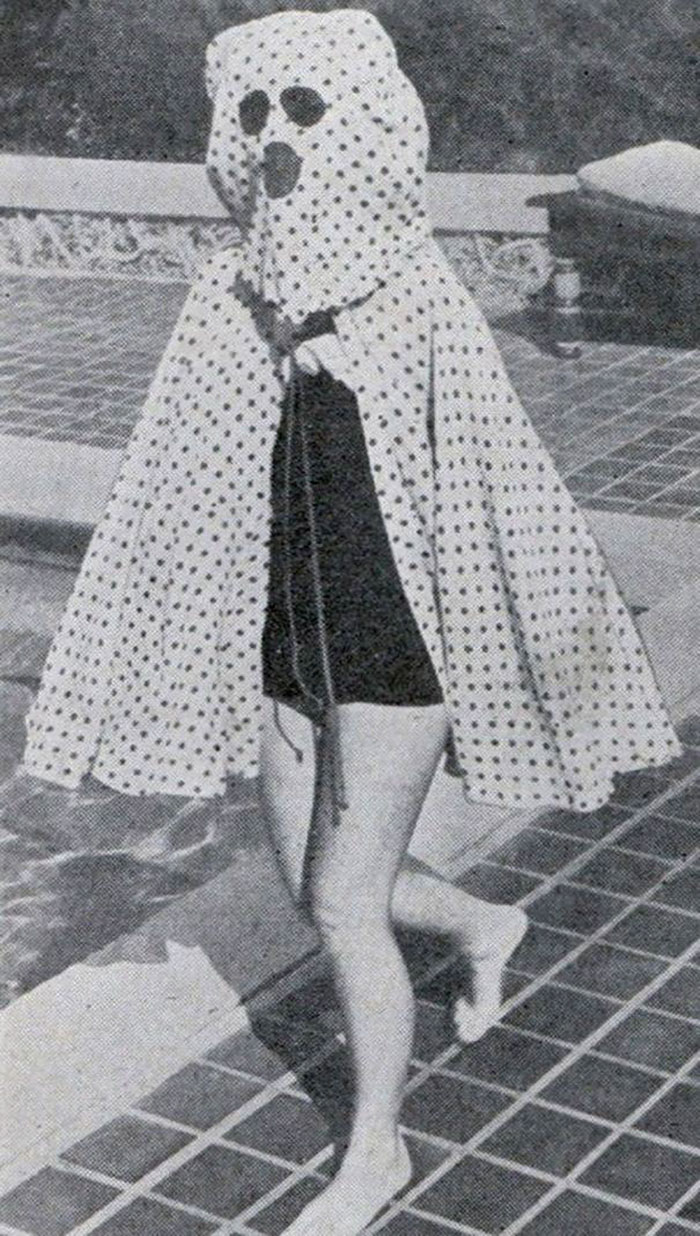 Before The Invention Of Sun-Screen In The Mid 1940s, Bathers Wore Garments Like This Freckleproof Cape To Protect Themselves From The Sun. The Cape Also Features Built-In Sunglasses