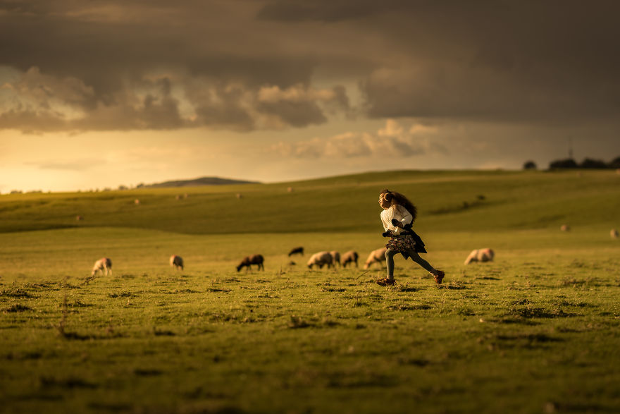 Ireland- Girl Running Among Sheep