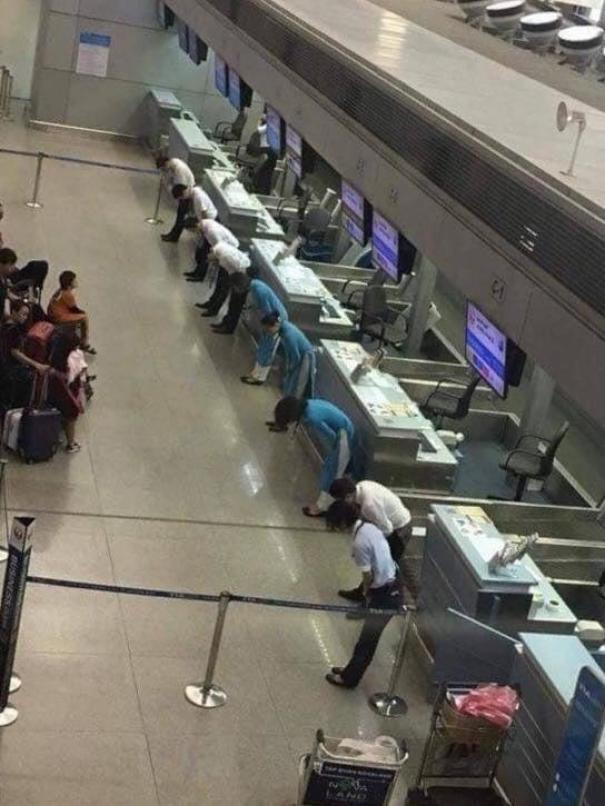 Flight Delayed In Japan. Airline Employees Bow To The Passengers To Apologise