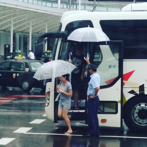 Bus Driver Holding An Umbrella So That You Don’t Get Wet While Opening Yours