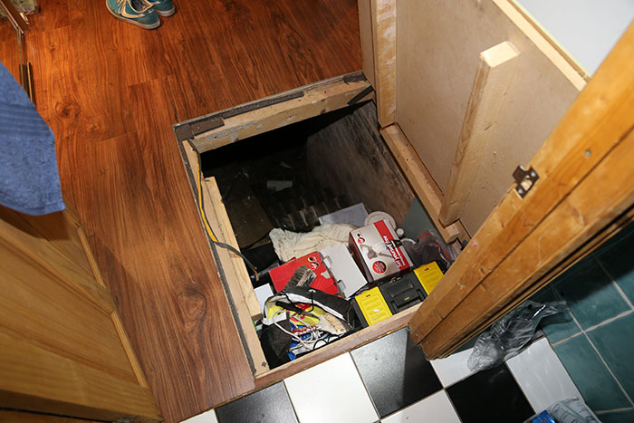 Guy Discovers A Trap Door In His Apartment Floor, Finds Something That Wasn't In The Lease