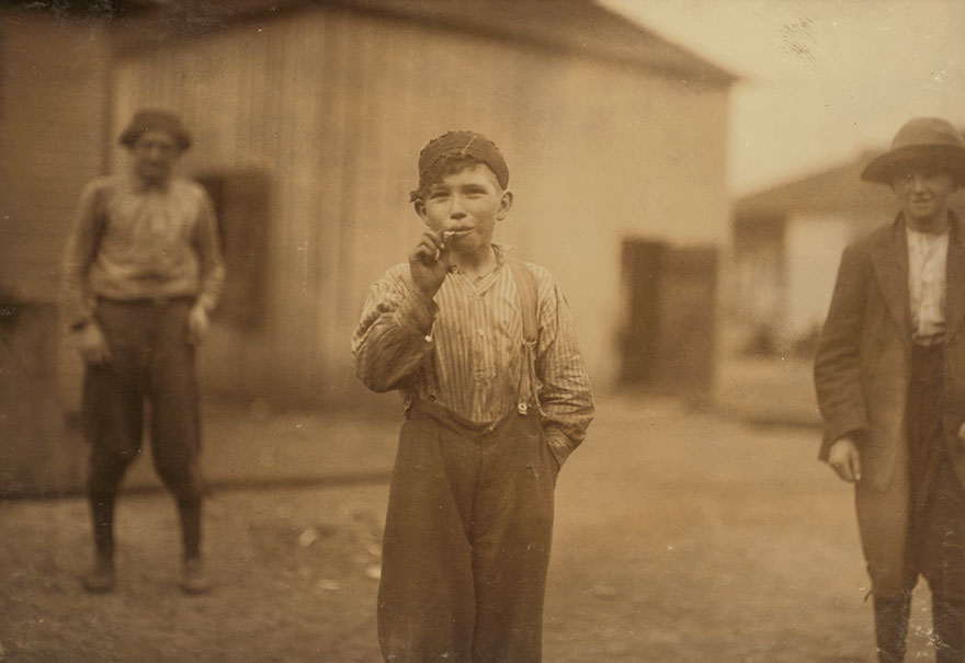 John Tidwell, A Cotton Mill Product. Doffer In Avondale Mills. Many Of These Youngsters Smoke. Location: Birmingham, Alabama