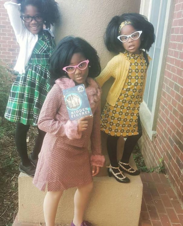 Three Girls Dressed Up As The Women Portrayed In "Hidden Figures"