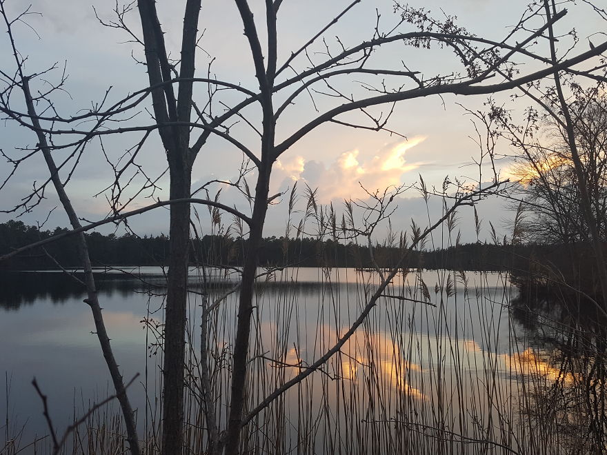 Sunset Reflections Of Moving Clouds