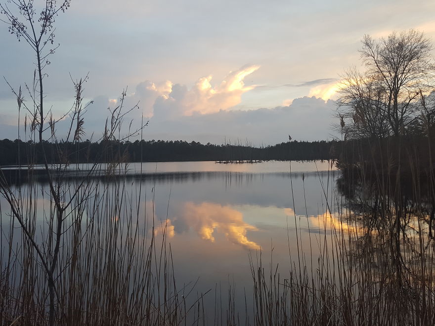 Sunset Reflections Of Moving Clouds