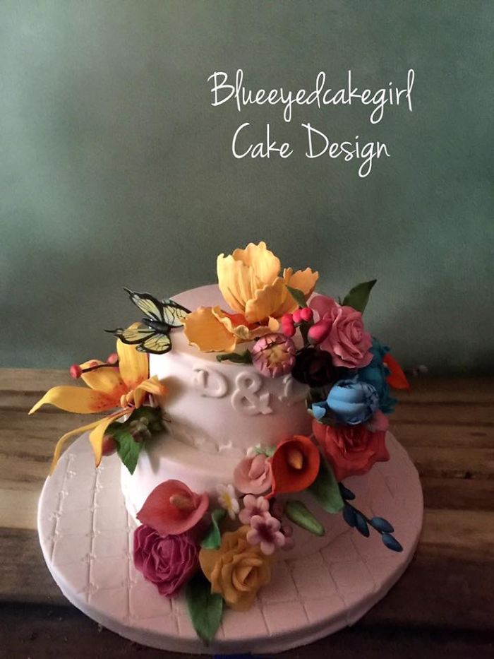 A Dutch American Wedding Cake With All Sugar Flowers And Butterflies