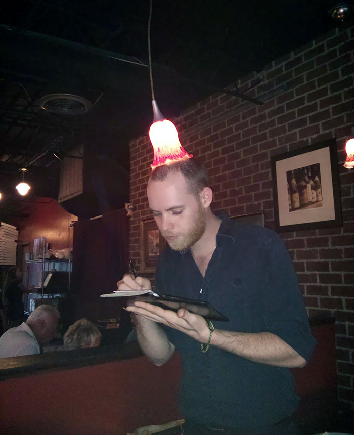 Our Waiter Got Tired Of Hitting His Head On The Light. His Solution: