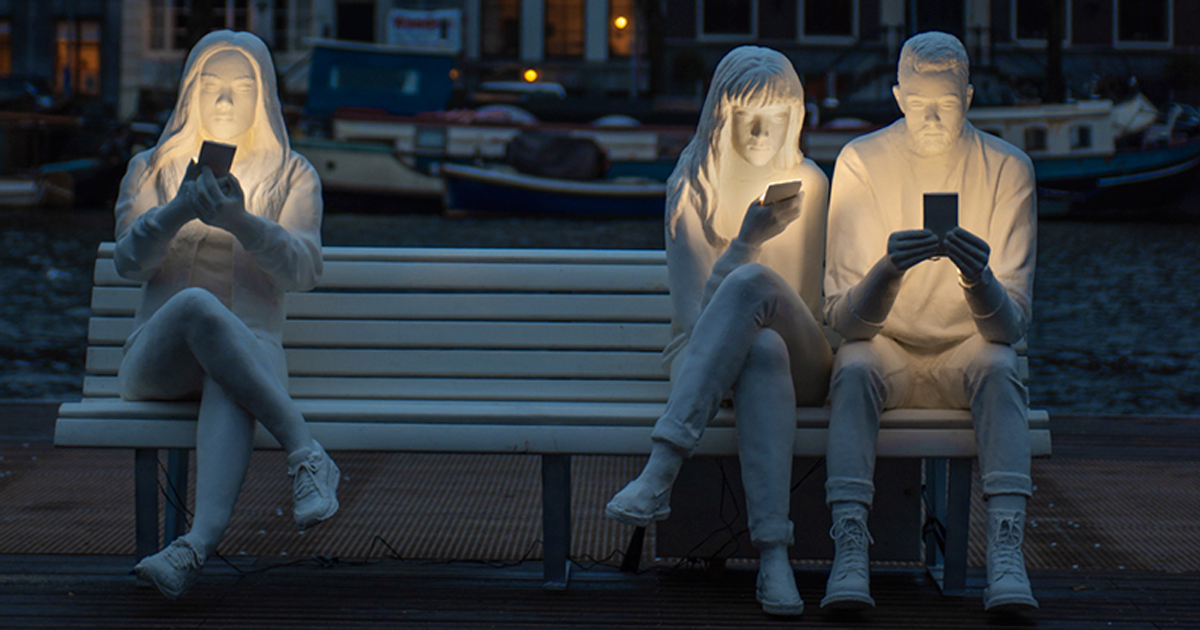 staring at phones statue