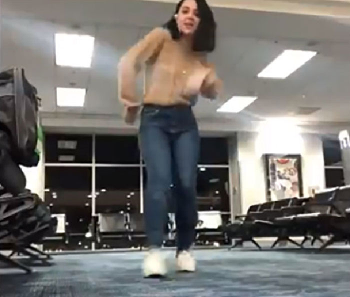 This Woman's Flight Was Canceled For 4 Hours, So She Decided To Entertain Herself By Dancing In An Airport With A Cat