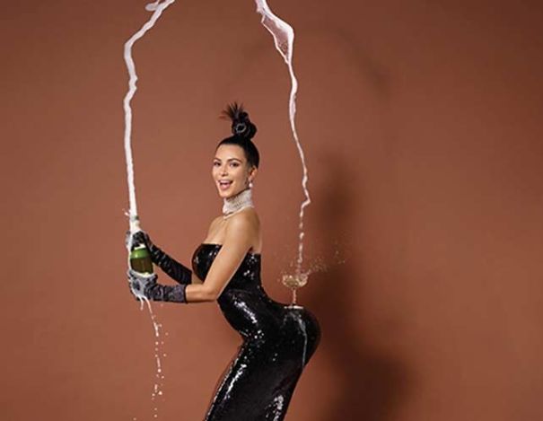 Kim-Kardashian-champagne-glass-on-butt-5c462fdf87d99.jpg