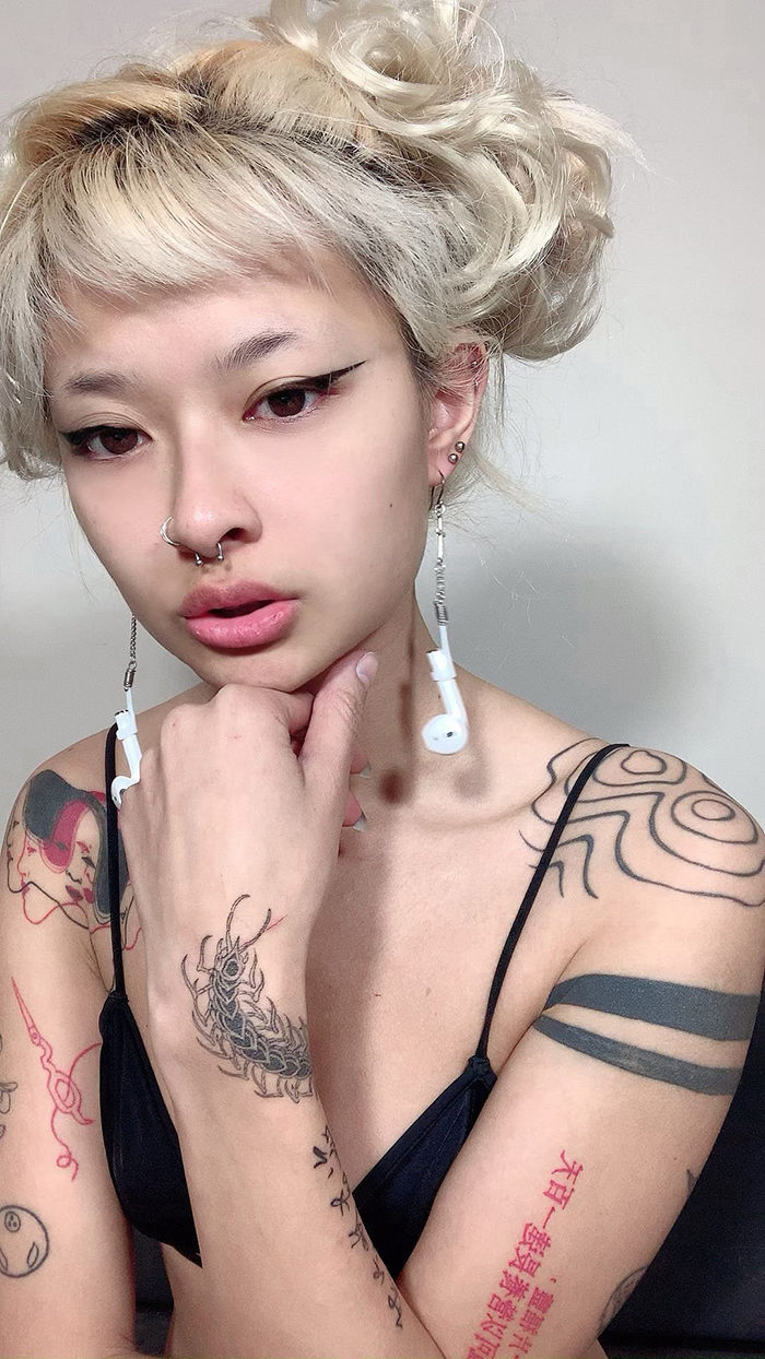 In Order Not To Lose Her AirPods, This Woman Literally Pierced Them Through Her Ears