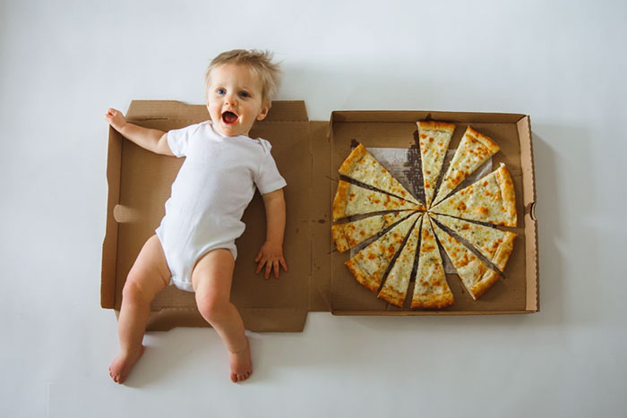 Mom Documents Her Baby's Growth During His First 12 Months Using Pizza Slices With Different Toppings