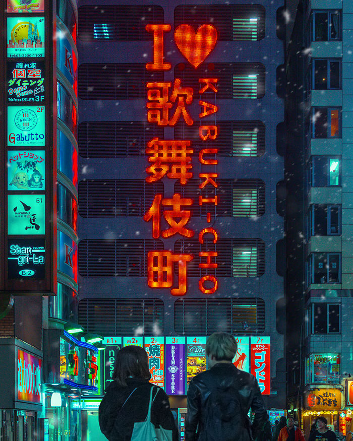 Night view of vibrant Tokyo Kabukicho district with illuminated signs and two people capturing photos on a dream trip with a camera.
