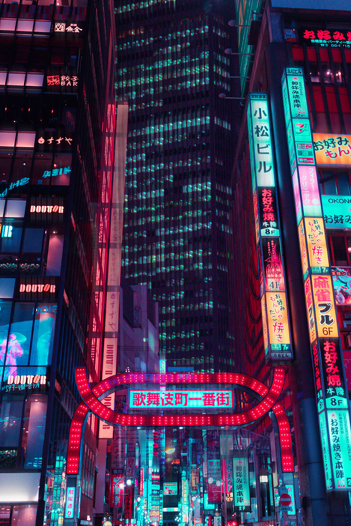 Tokyo city street at night illuminated by neon signs captured on a camera during a dream trip to Tokyo.