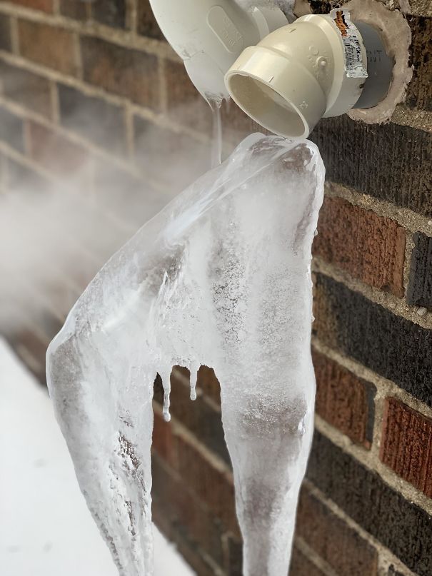 My Neighbor’s Furnace Exhaust Is Creating An Interesting Icicle