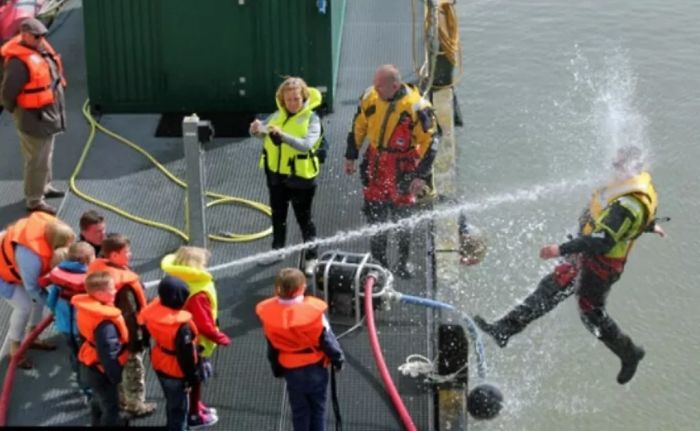 Kids Playing With Fire Hose During Coast Guard Demo