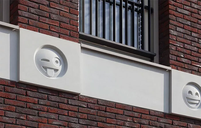 22 Emoji Decorate An Apartment Building As Modern Day ‘Gargoyles’