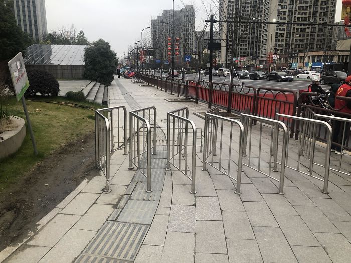 Fences Are Intended To Prevent Bikes From Going On Sidewalk... But They Can Just Go Around It