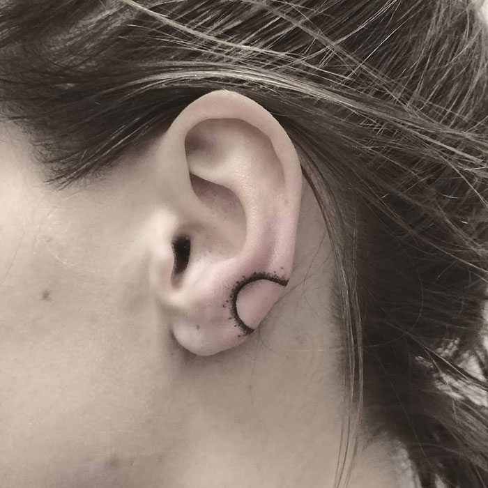 Tiny Eclipse Ear Tattoo