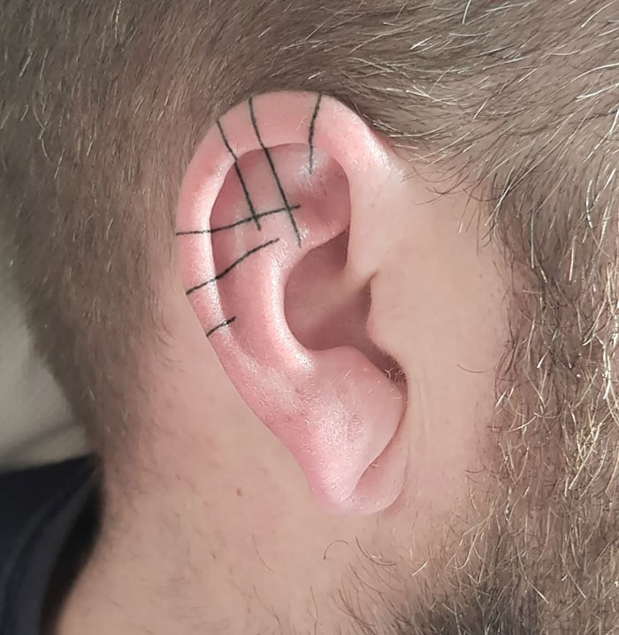 Hand Poked Line Art Ear Tattoo