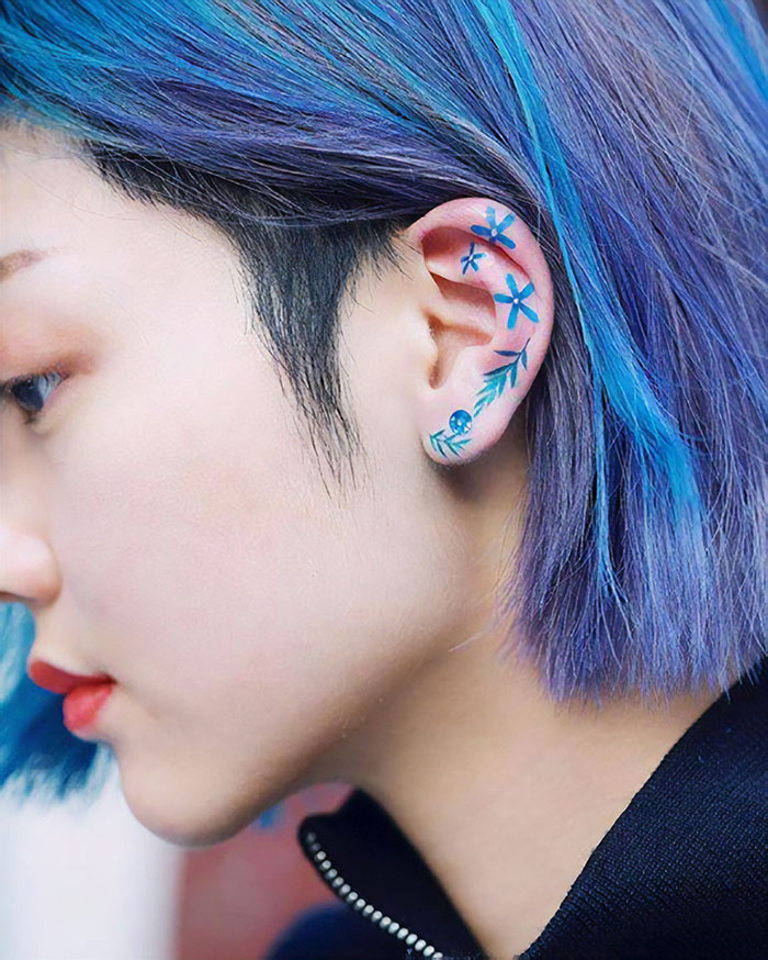 Bright Blue Ear Tattoo