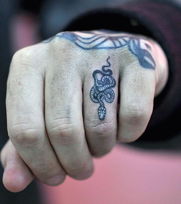 Micro Snake Finger Tattoo