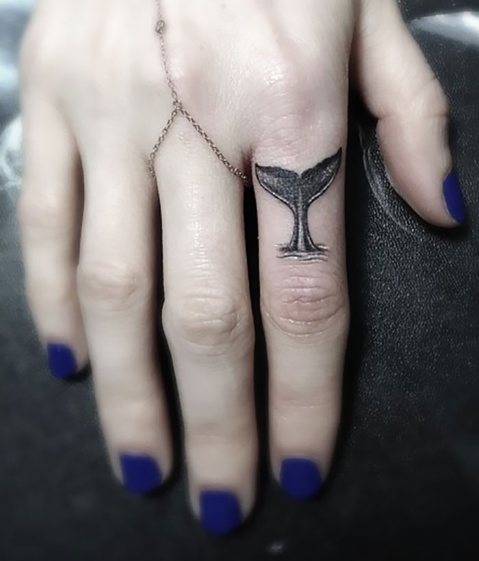 Whale Tail Finger Tattoo