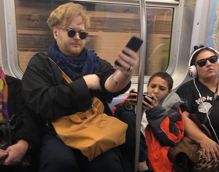 Kid Refuses To Move His Legs On A Subway, Someone Captures His Reaction When A Guy Sits On Them