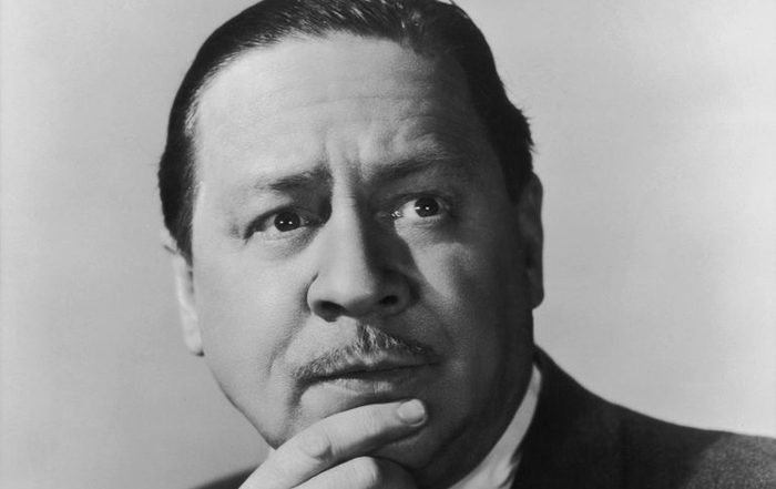 Robert Benchley to a man in a uniform