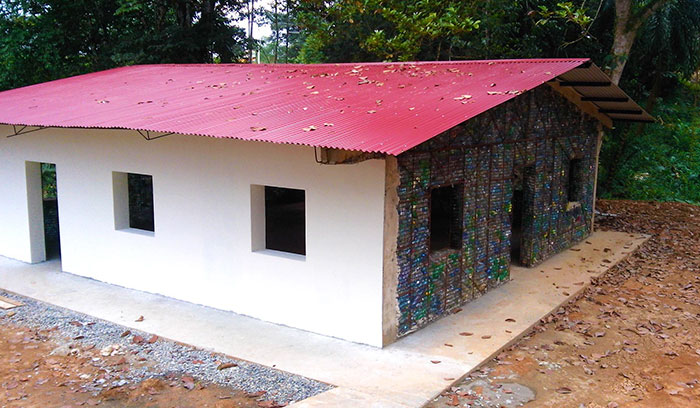 Man Builds Homes Out Of Plastic Bottles And They Look Just Like Regular Houses