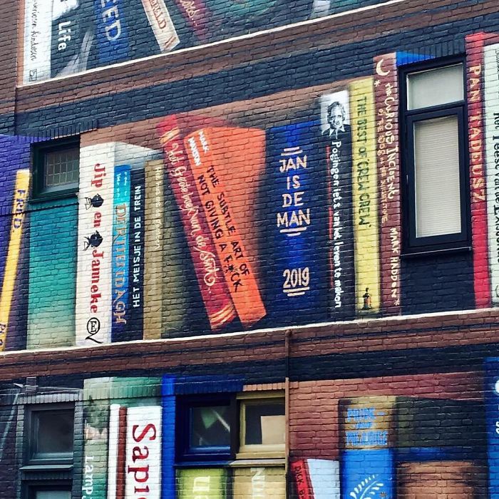 Dutch Artists Paint Giant Bookcase On An Apartment Building Featuring Residents' Favorite Books