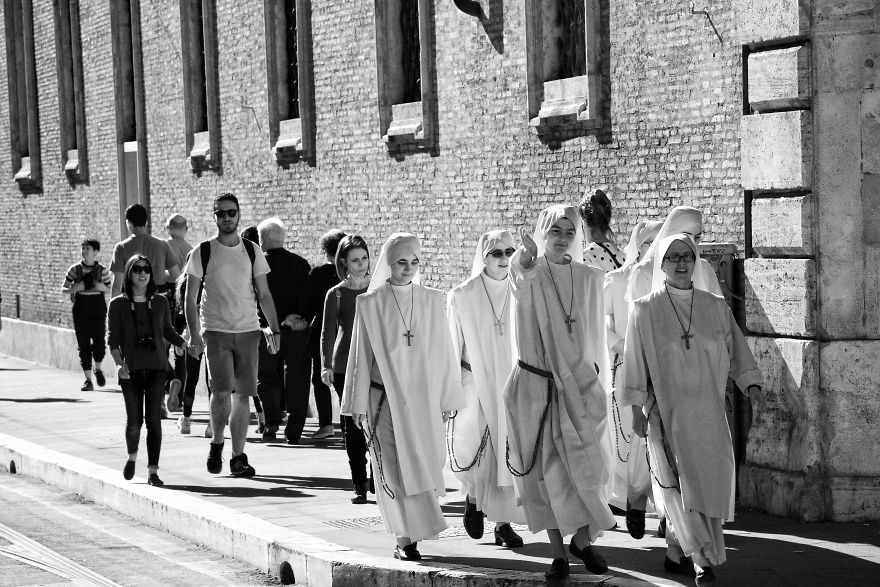 Street Shot Of A Group Of Nuns In White Walking In Rome