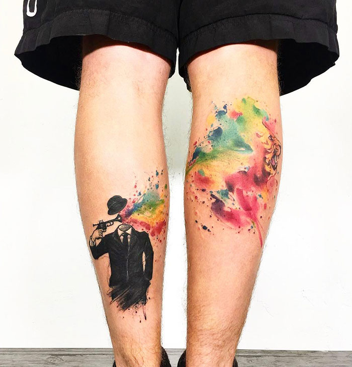 Colorful person and lion leg tattoo