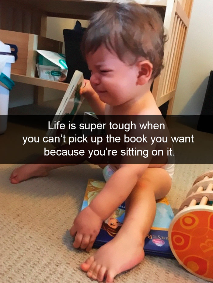 Life Is Super Tough When You Can’t Pick Up The Book You Want Because You’re Sitting On It