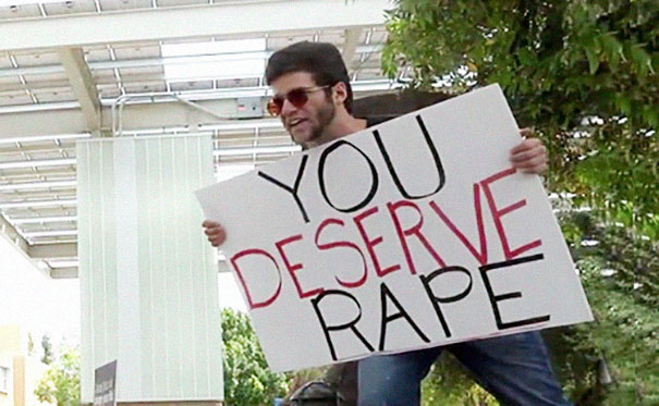 Preacher Carrying 'You Deserve To Be Raped' Sign Gets Hit With A Baseball Bat And The Comments Are Priceless