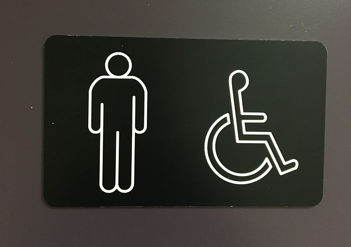 The Man On The Bathroom Sign Has One Armpit That Is Higher Than The Other