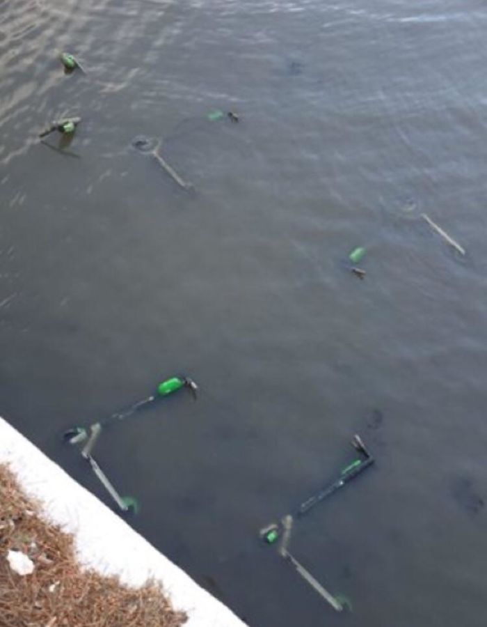 Throwing The Community Electric Scooters Into The Water