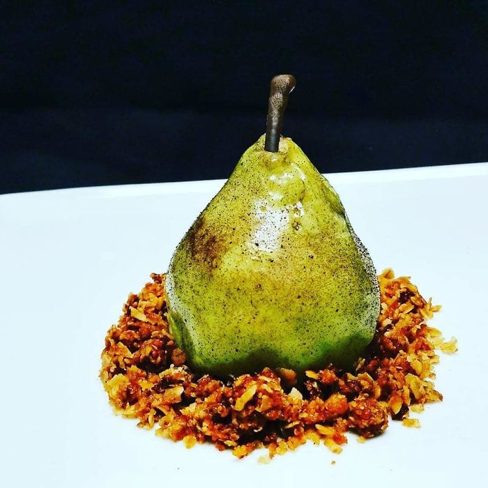 Pear Crumble. Pear Mousse, Filled With A Custard, Mirror Glazed And Flecked, Brown Butter Granola
