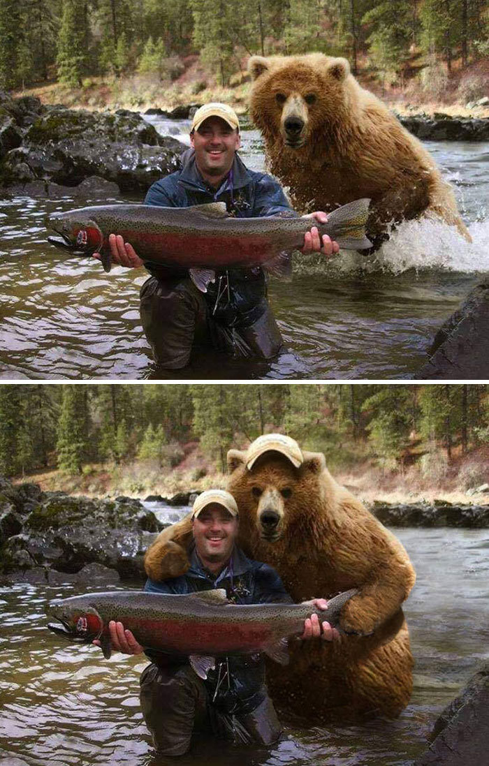 Hombre sosteniendo un pez con un oso detrás