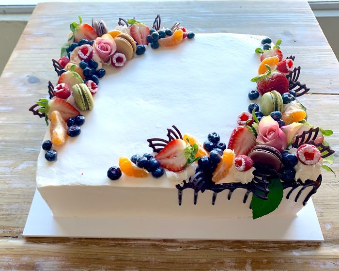 Fruit Designer Decorates A Cake