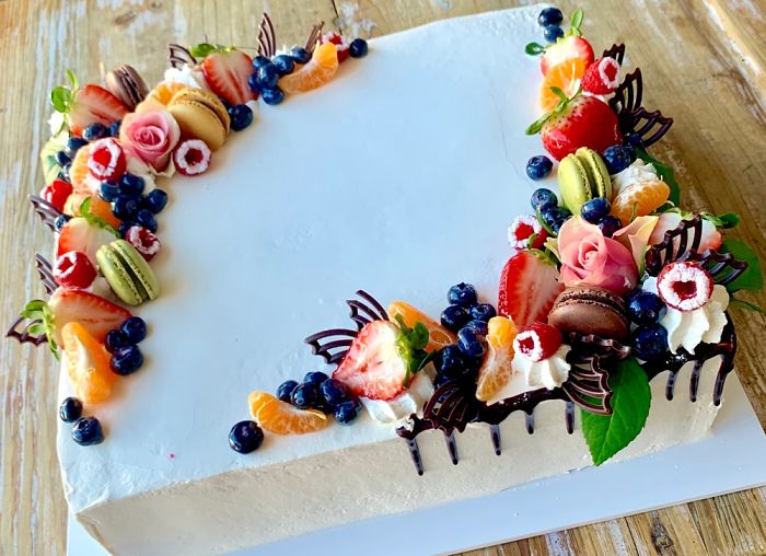Fruit Designer Decorates A Cake