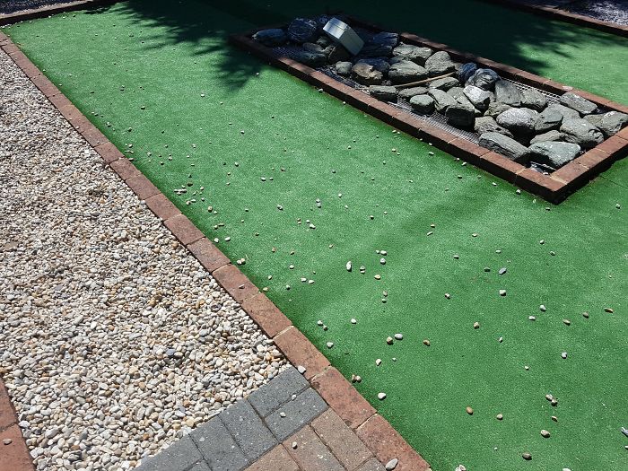 "Hey, So What Should We Put Around The Mini Golf Courses?" "How About Little Pebbles And Stones That Kids Can Kick All Over The Place?"