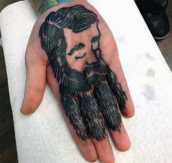 Bearded Man On A Palm