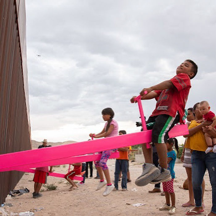 Children From The US And Mexico Play Together On These Seesaws Built On The Border Wall In Defiance Of Trump