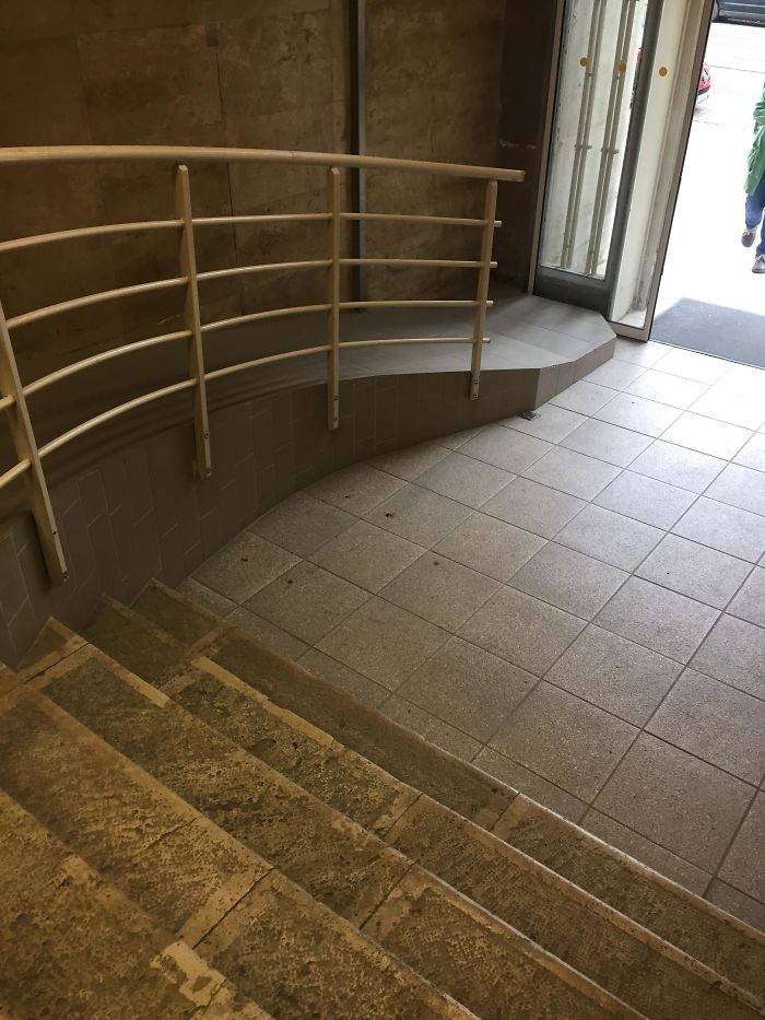 A Handicap Ramp With A Step At The Bottom