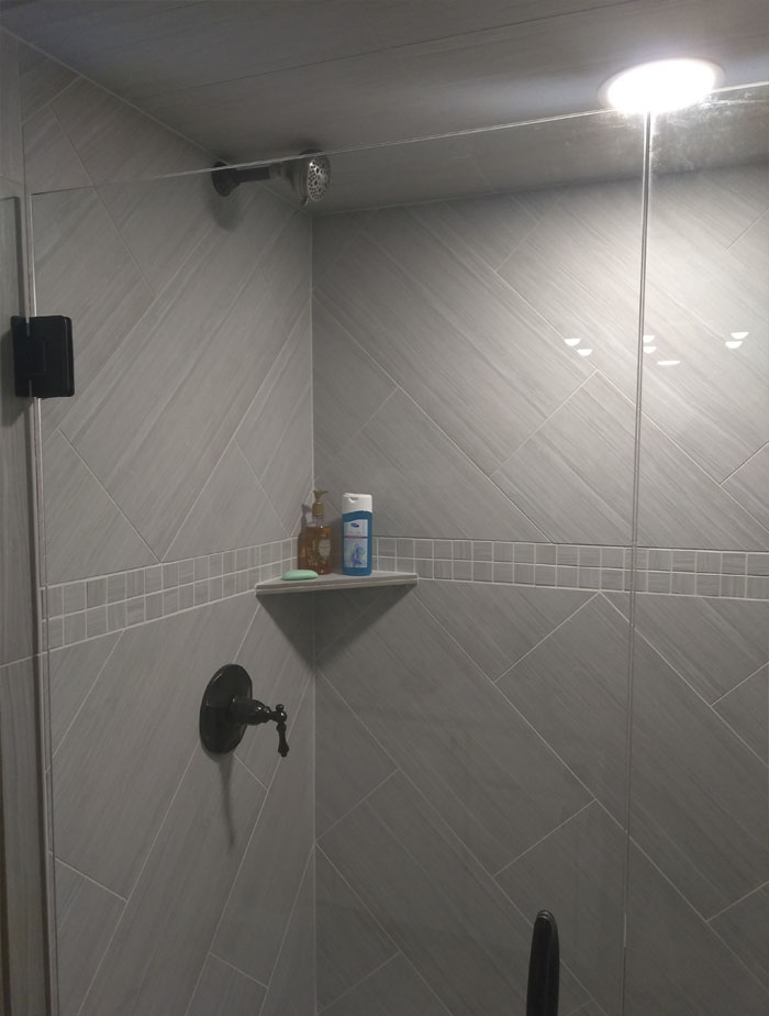 My Mom Had Her Guest Bathroom Remodeled While She Was Out Of Town. She Wanted The Shower Head Up High So Tall People Didn't Have To Crouch Or Lean Way Back. Came Home To Find This, Which Shoots The Water Straight Across To The Opposite Wall