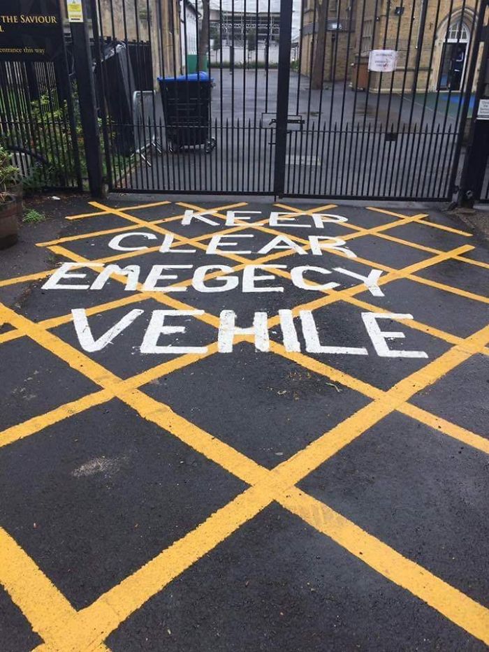 Off Centre, Misspelled, Hard To See Road Markings At A Local School